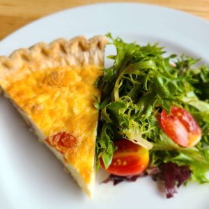 Roasted-tomato-leek-Parmesan-quiche-and-mixed-greens-salad